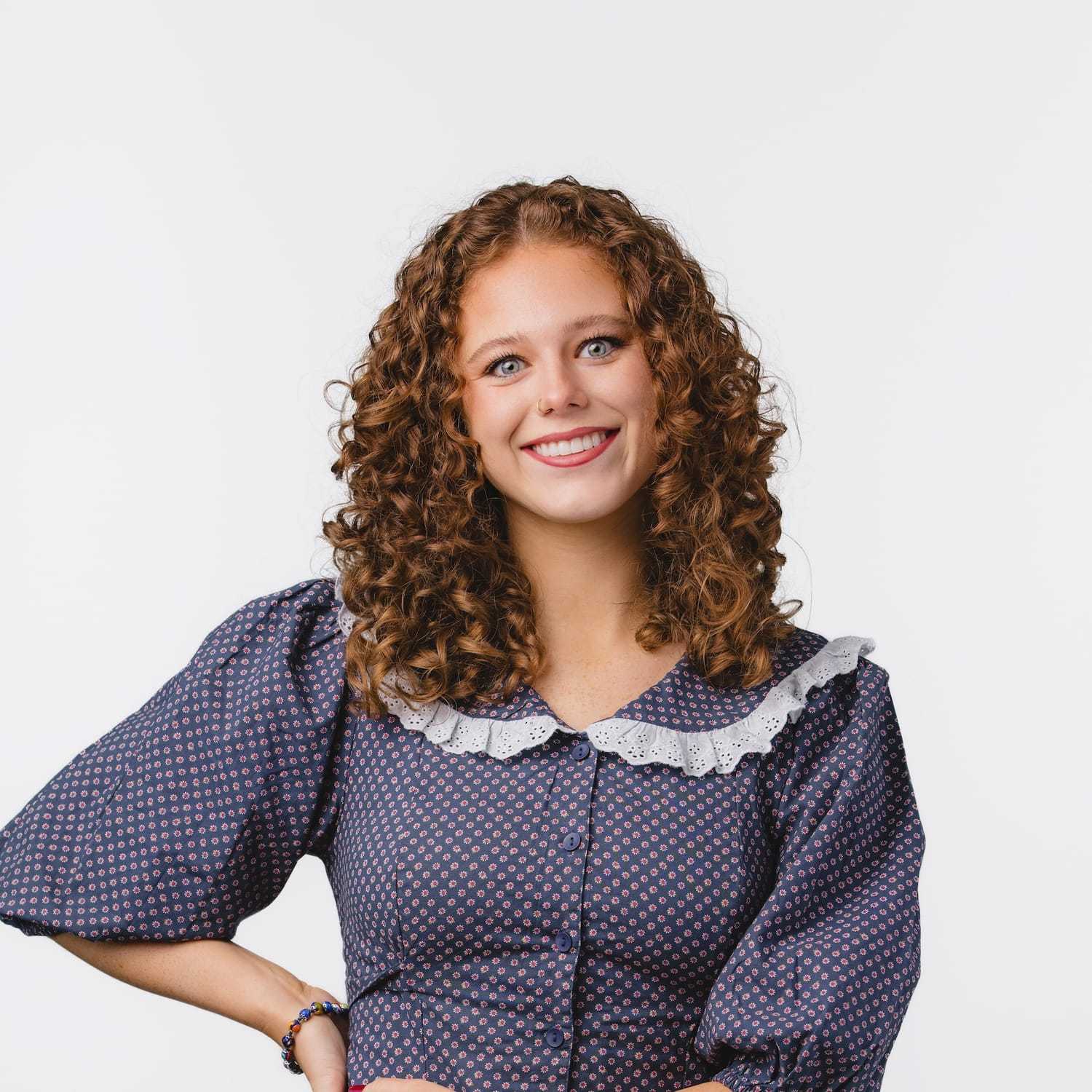 Portrait of Frannie, a professional stylist at Bobby Cooper, showcasing their expertise and style.